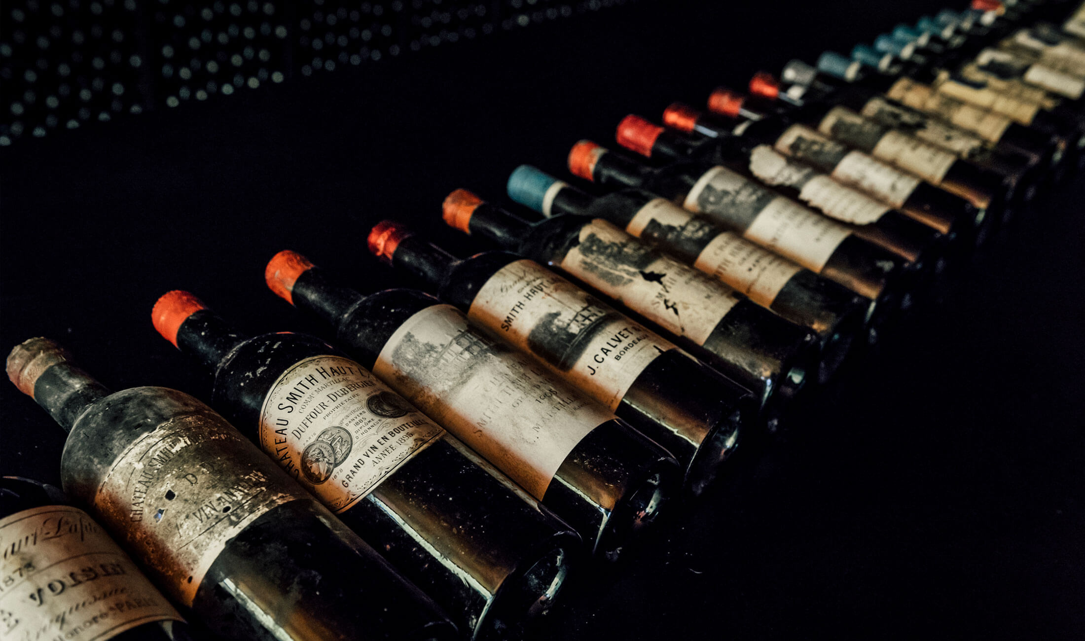 Vintage fine wines lined up in a cellar in France